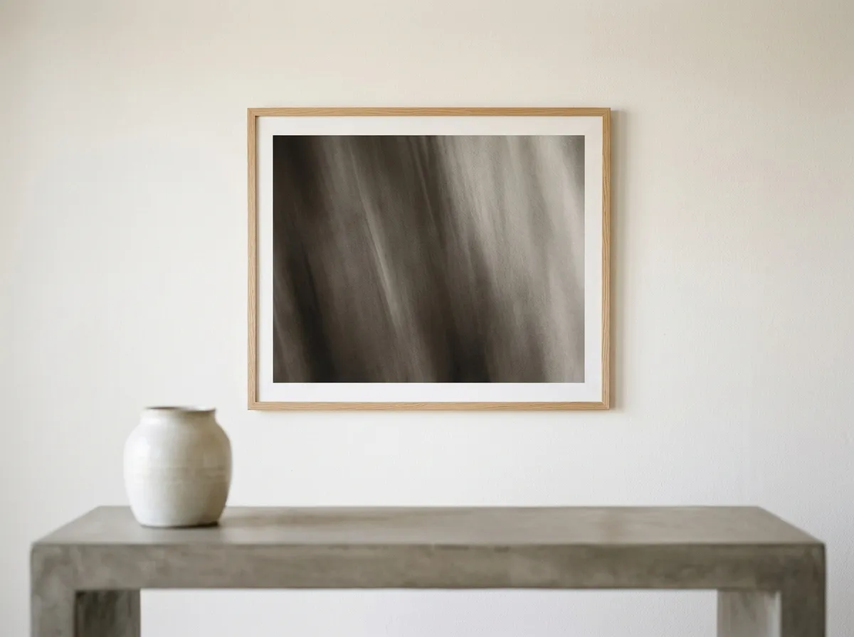 A tonal monochrome print used as modern wall art for any interior above a concrete console table.